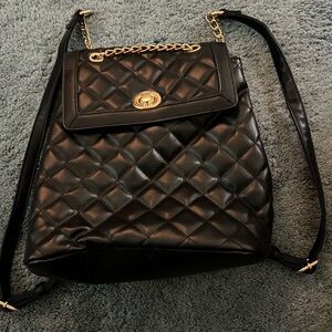 Black quilted backpack purse